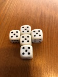 Five Yahtzee dice all on five in the shape of a cross for no particular reason.